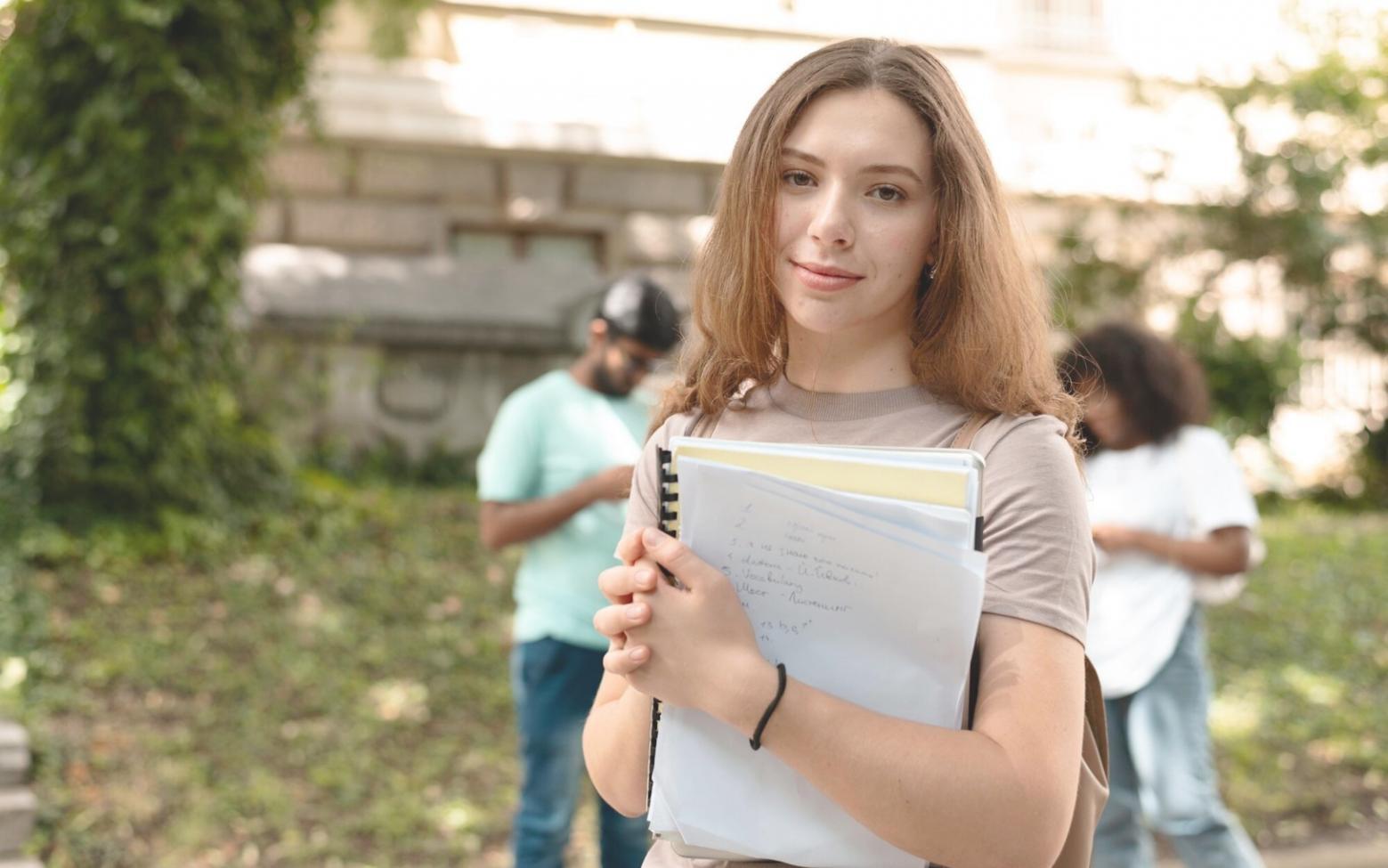 Business planning workspace with financial documents and laptop